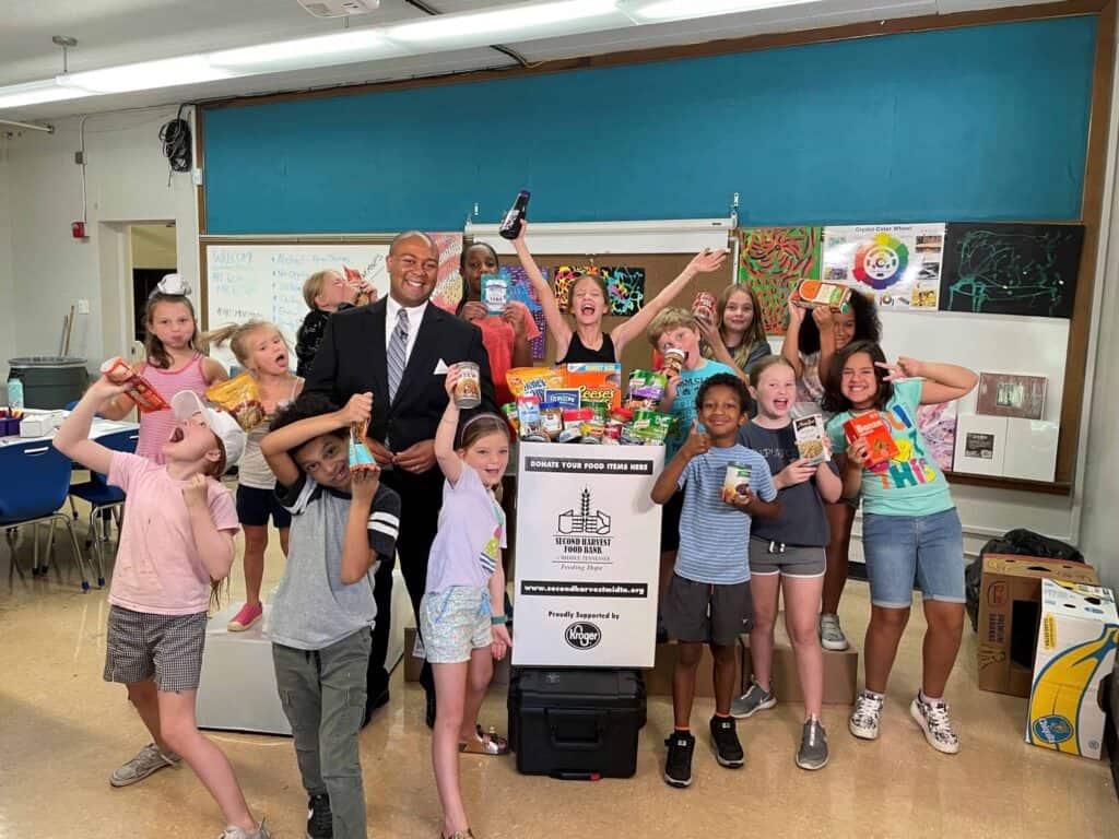 A group of kids posing in a classroom