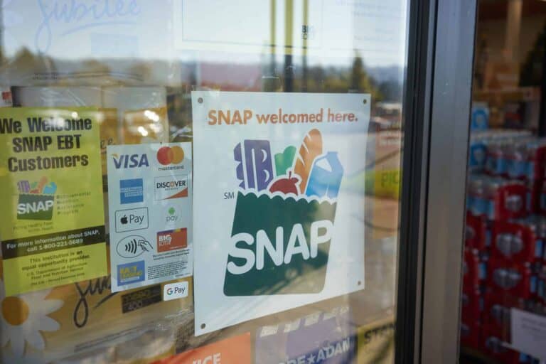 A SNAP sign on a grocery store door