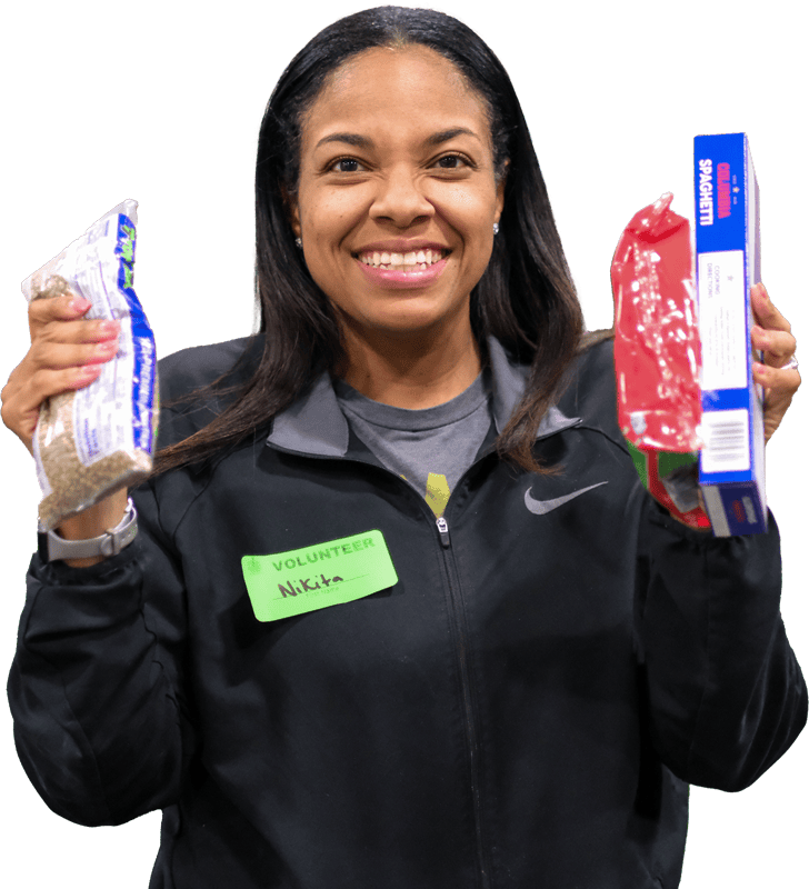 A smiling Second Harvest volunteer