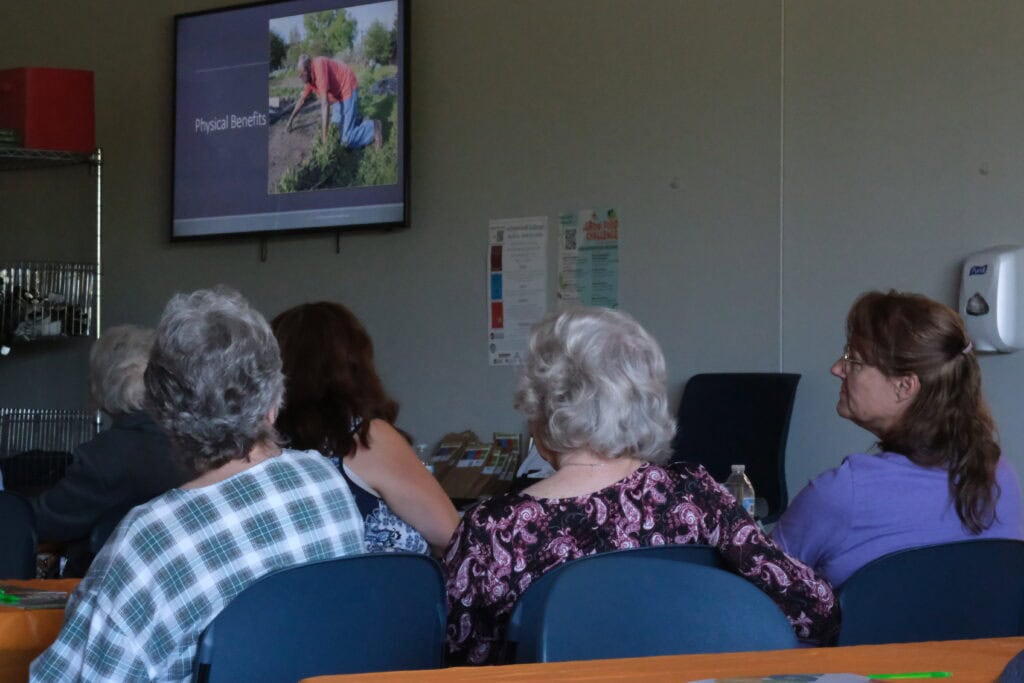 Three community seniors learning how Agriculture and Food Security are related at Second Harvest's Project Grow Educational Series. 